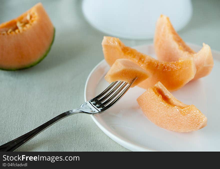 Dish with slices of melon