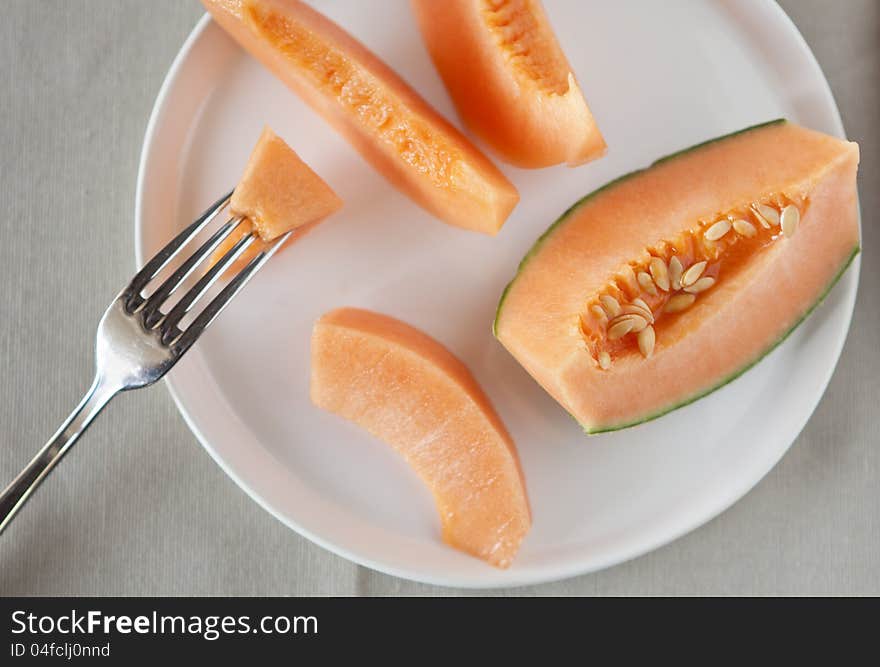 Dish with slices of melon