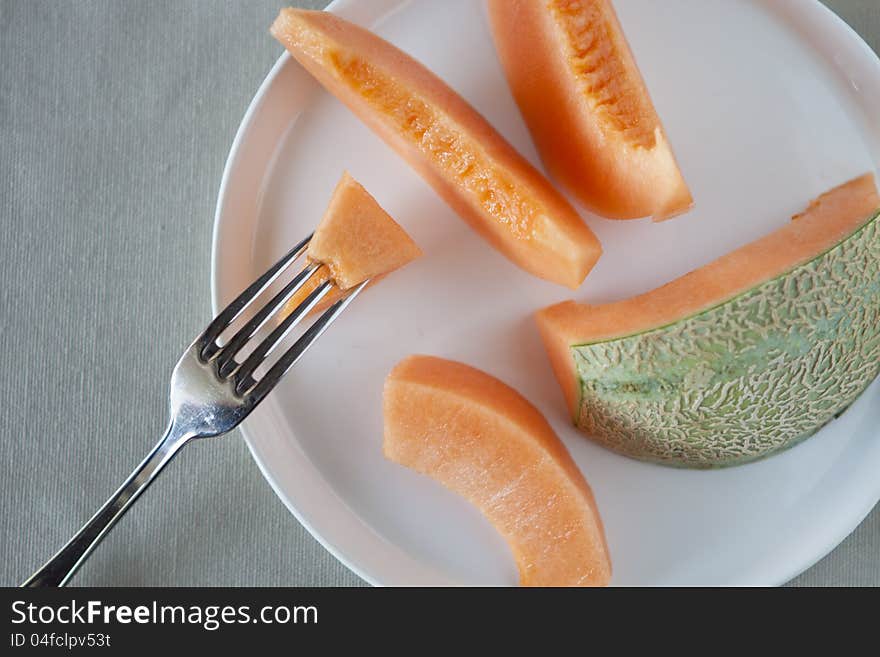 Dish with slices of melon