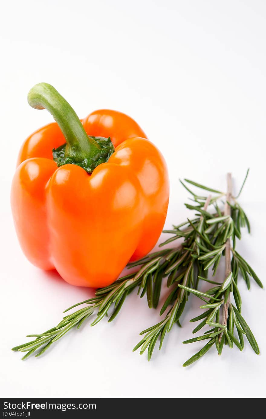 Orange pepper with rosemary