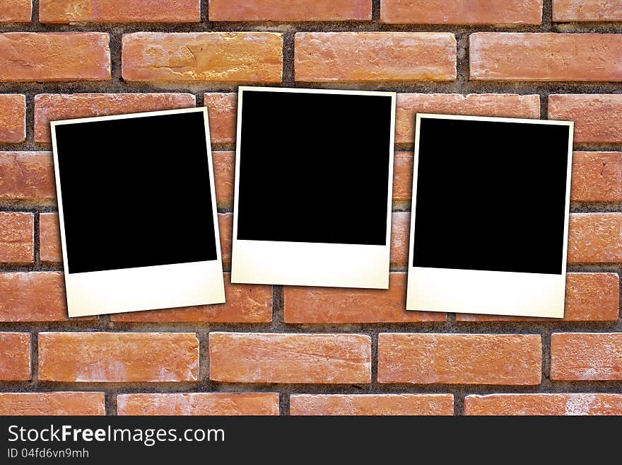 Blank vintage paper and photo frame on brick background