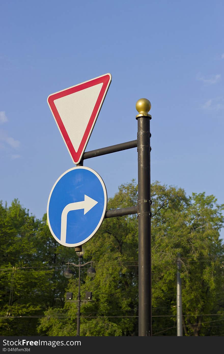 Road sign against the dark blue sky