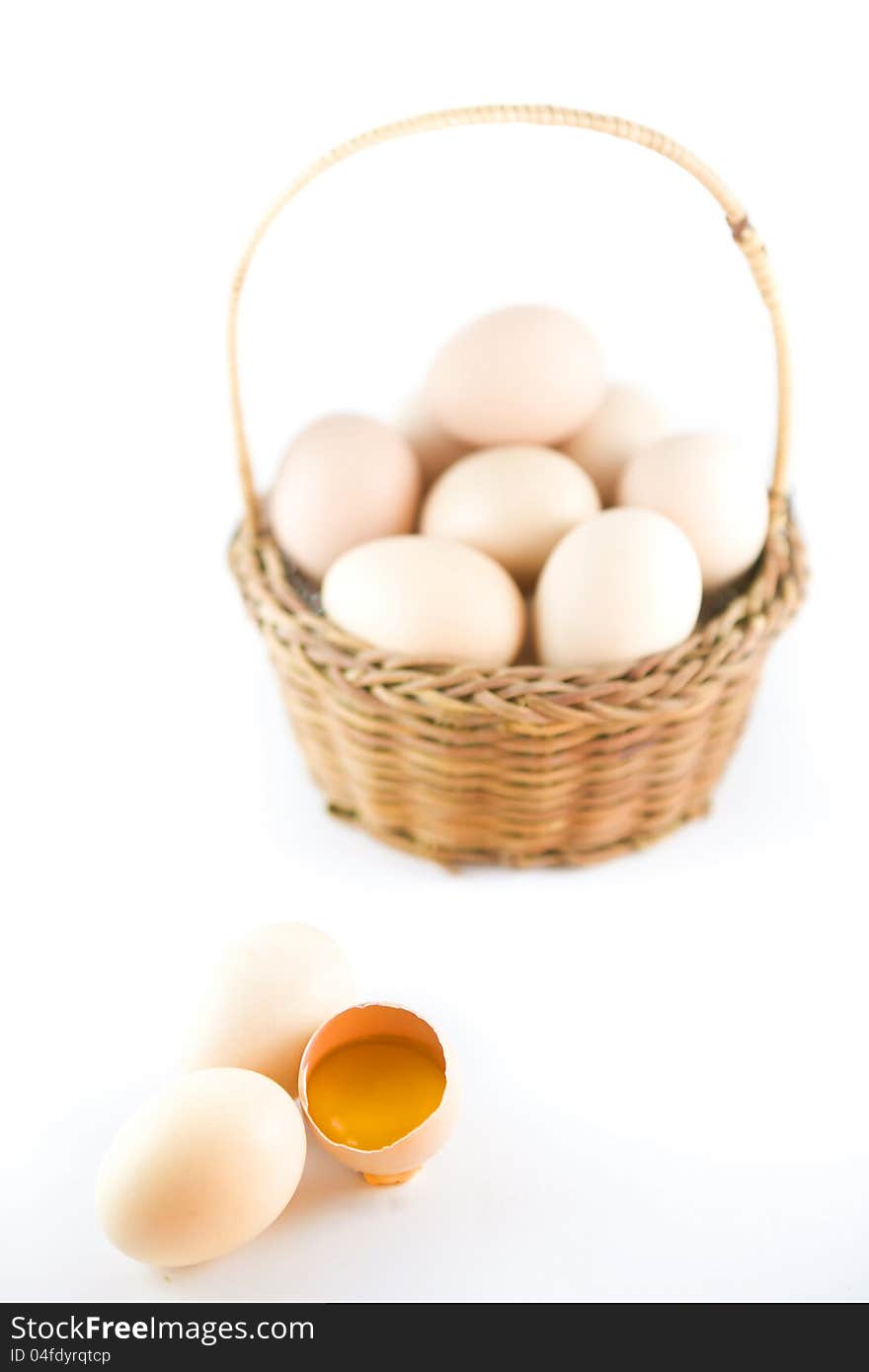 Eggs and yellow yolk on white background