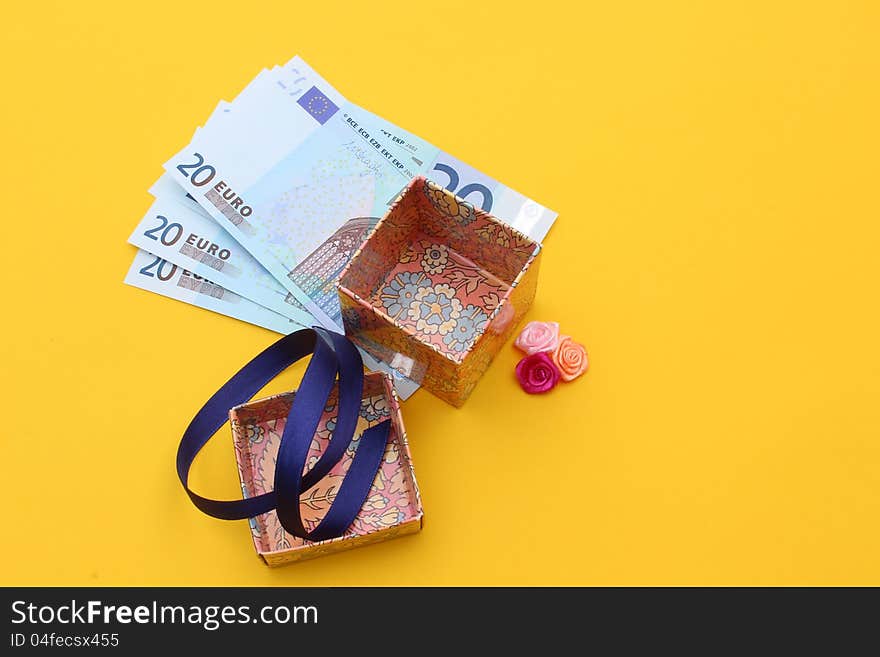 Fine image of money under the gift box. Fine image of money under the gift box