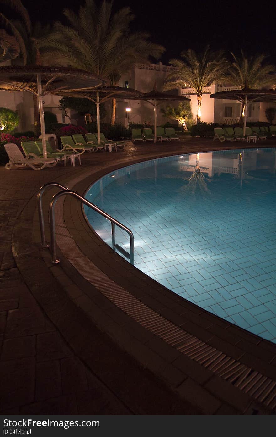 A view of a pool in the night. A view of a pool in the night