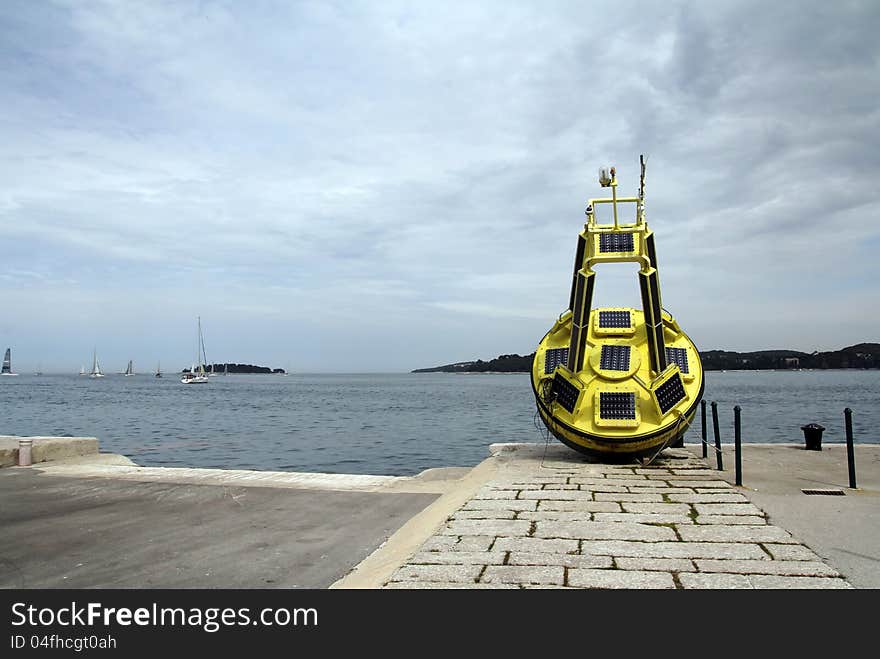 A navigation buoy in country in a harbour in Croatia