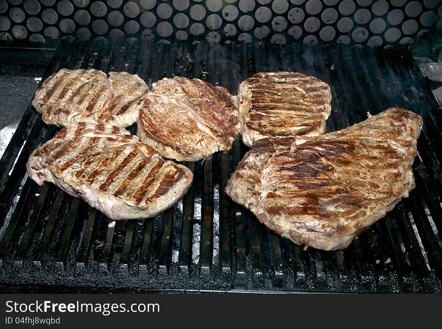 Steaks cooked on a grill in the restaurant