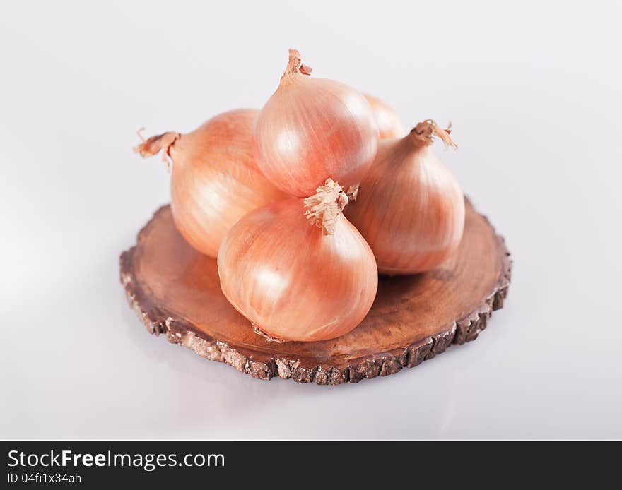 Pile of onions isolated on grey