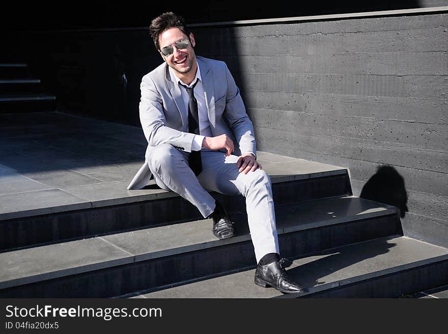 Portrait of a handsome young businessman laughing