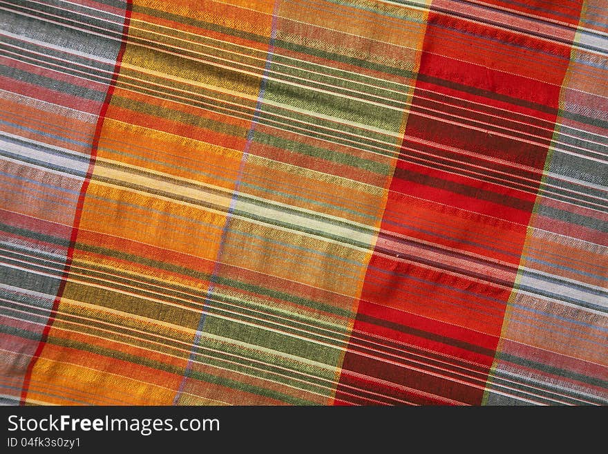 Close-up of multicoloured fabric with geometric pattern