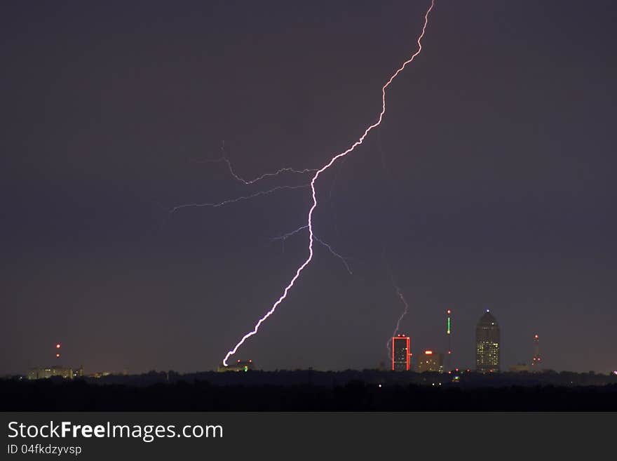 Lightning striking within a city. Lightning striking within a city