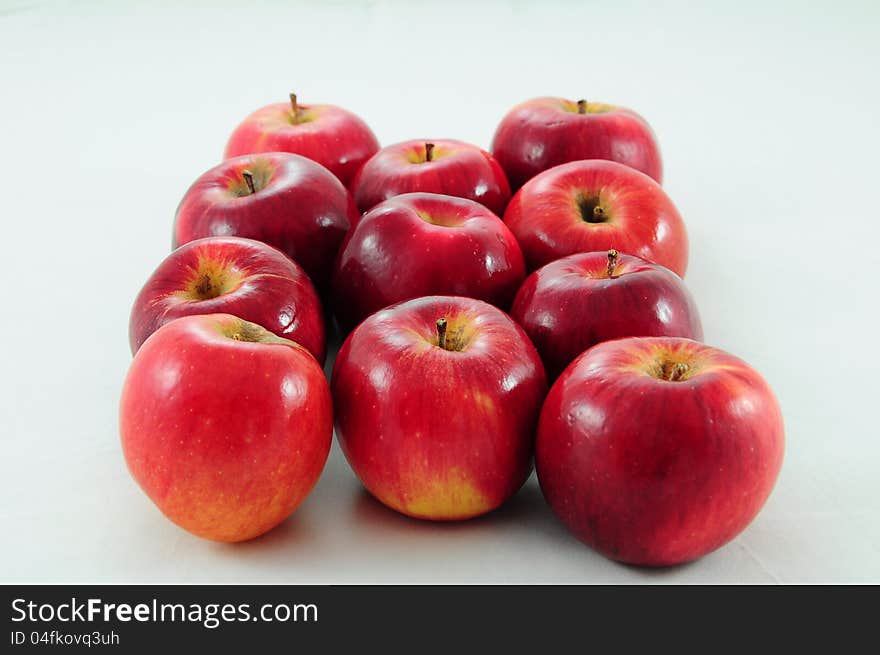 Fresh red apples on white