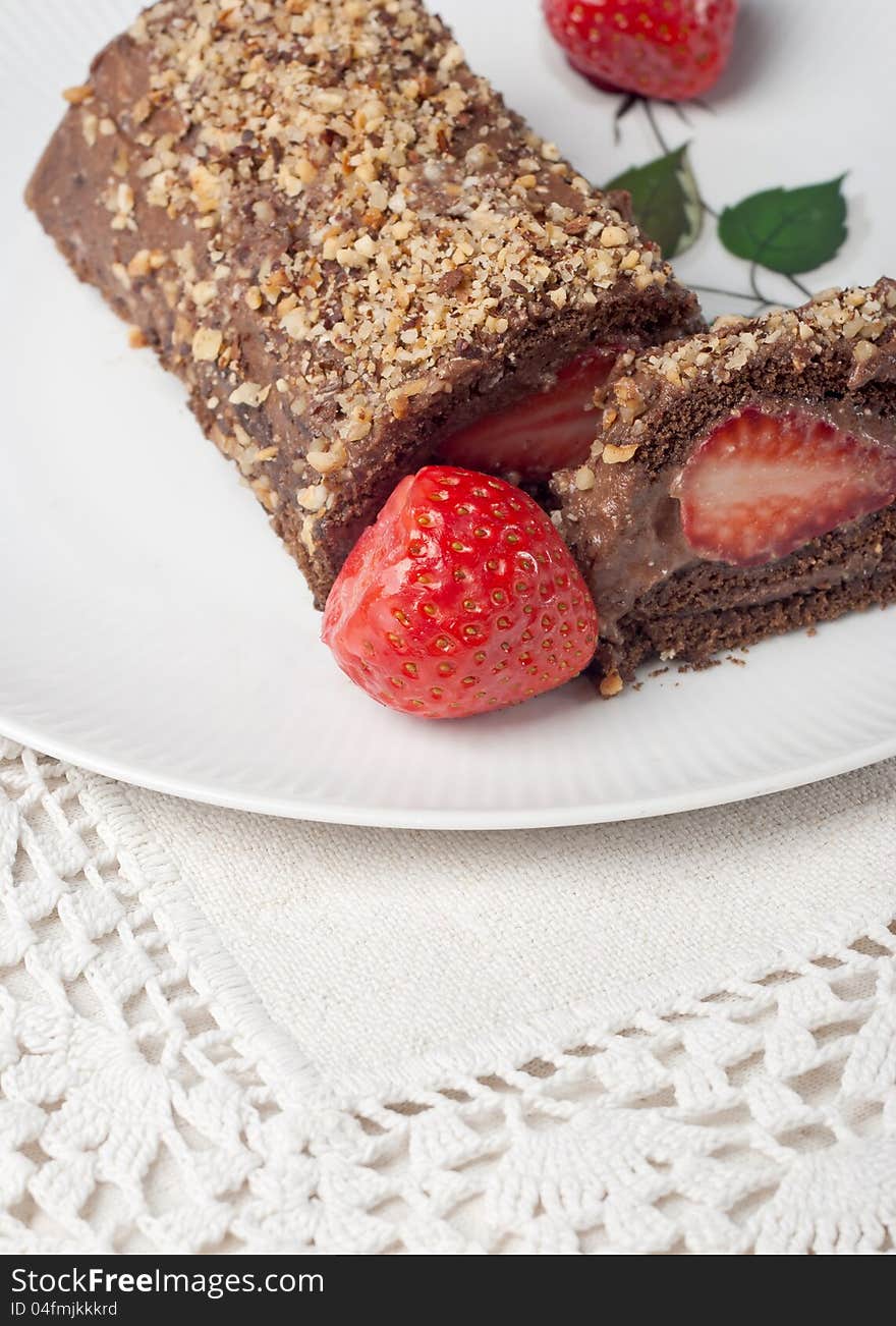 Chocolate swiss roll cake with strawberries. Chocolate swiss roll cake with strawberries