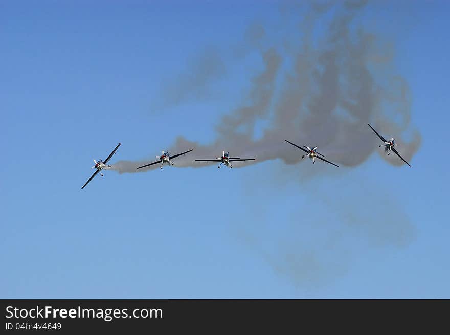 High aerobatic squadron, on its planes extra 300 L, for an exhibition. High aerobatic squadron, on its planes extra 300 L, for an exhibition