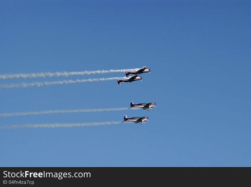 High aerobatic squadron, on its planes extra 300 L, for an exhibition. High aerobatic squadron, on its planes extra 300 L, for an exhibition