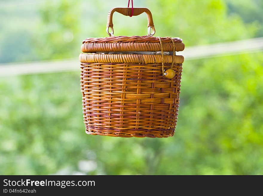 It is a basket ,and is weaved with wild rattan by hand by zhuang people in guangxi province ,china. It is a basket ,and is weaved with wild rattan by hand by zhuang people in guangxi province ,china