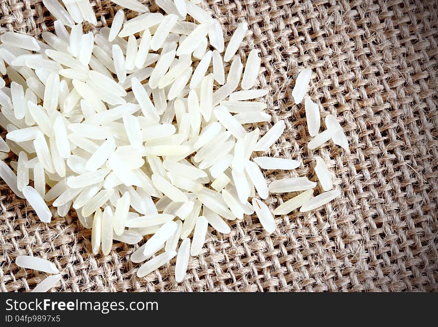 White long white rice on brown sack