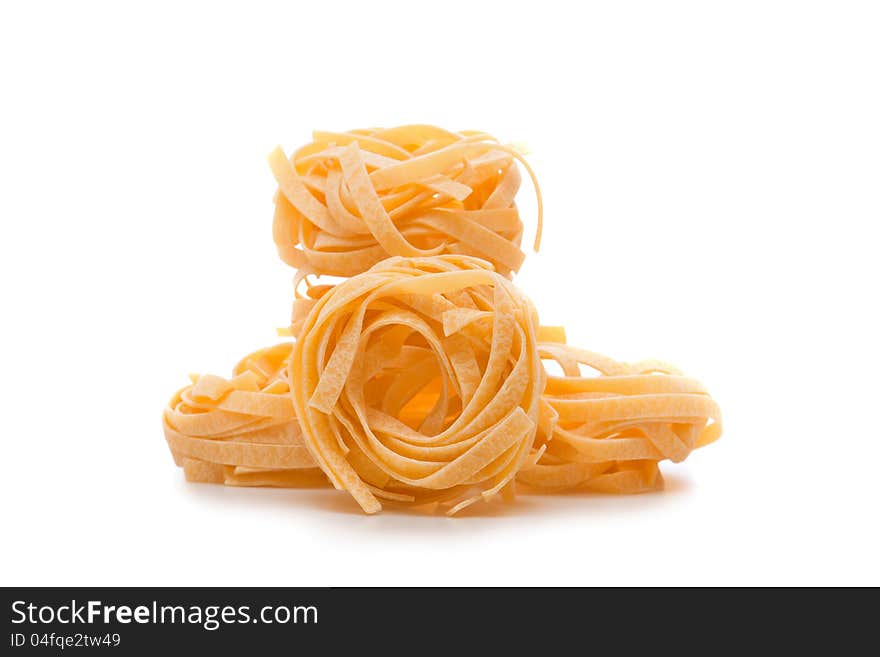 THREE UNCOOKED PASTA NESTS