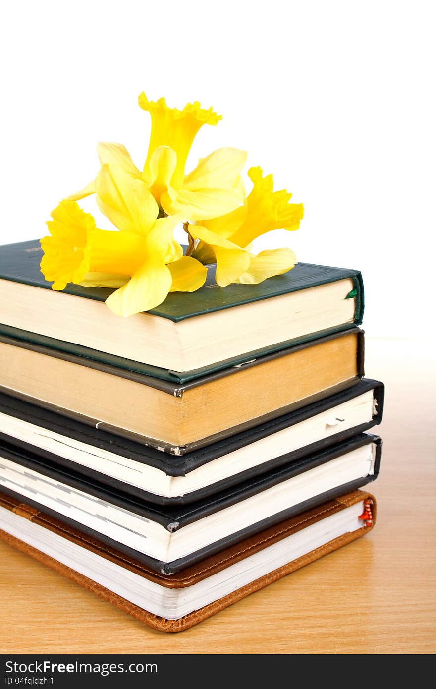 Books and a bouquet of daffodils