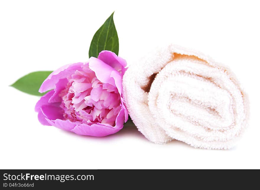 Spa towel with peony flower on a white background. Spa towel with peony flower on a white background