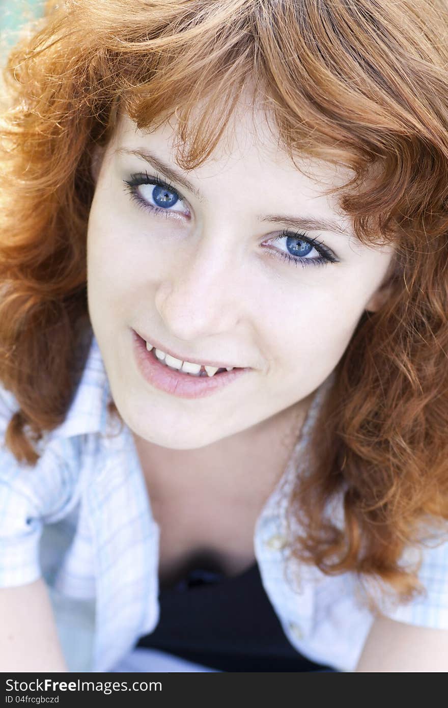 Close up portrait of young pretty woman looking up