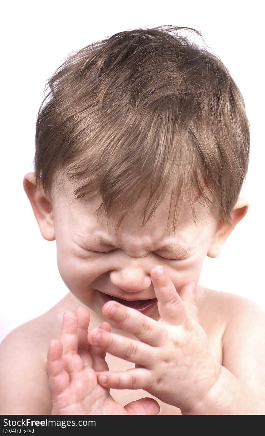 Crying baby boy isolated on white, close up