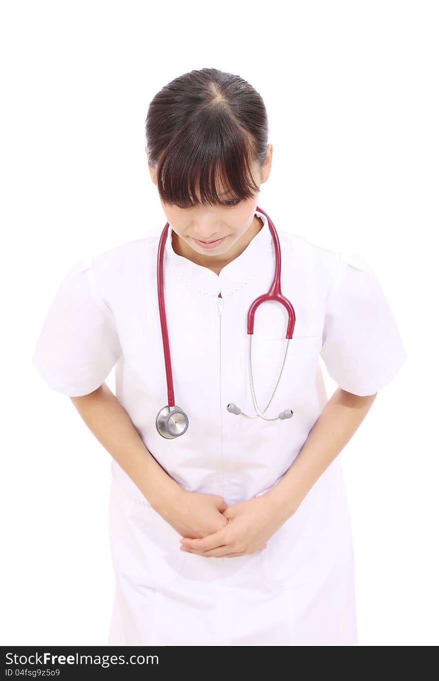 Young asian female nurse with hands crossed