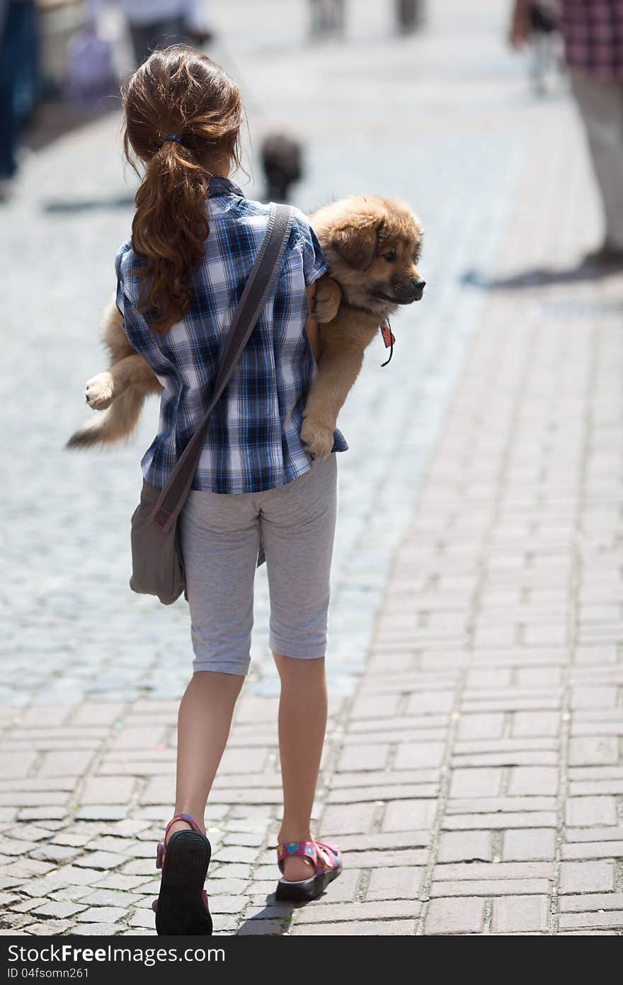 Girl Carries Her Puppy