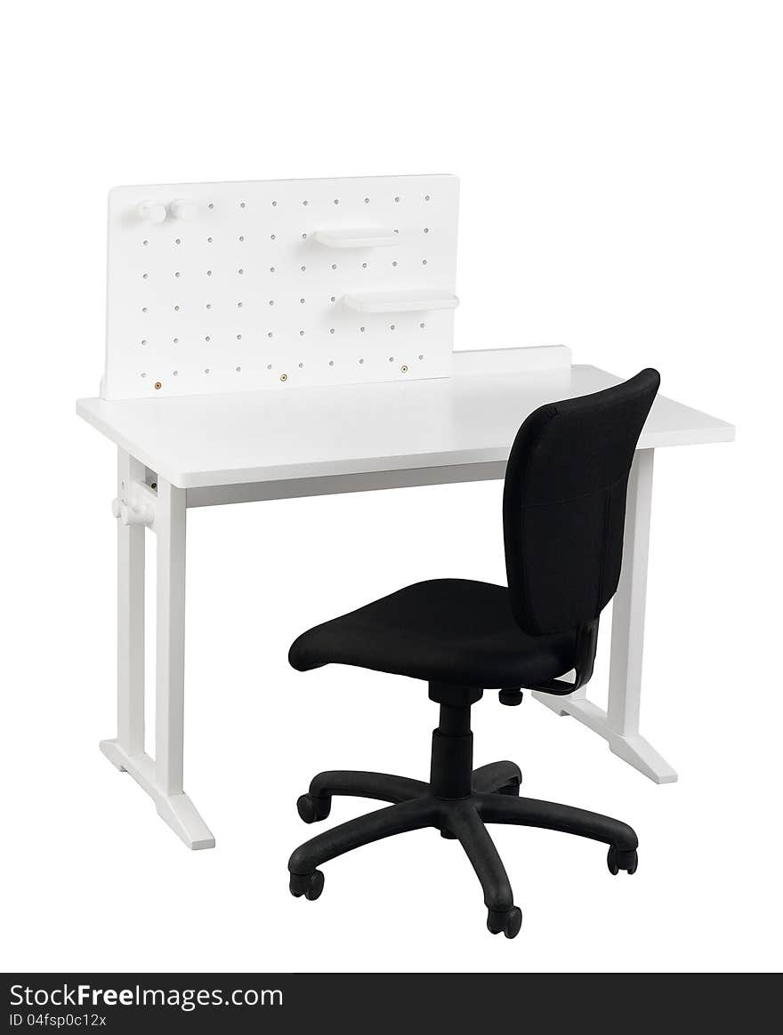 A table with little shelf and black chair for student to do homework or home office. A table with little shelf and black chair for student to do homework or home office