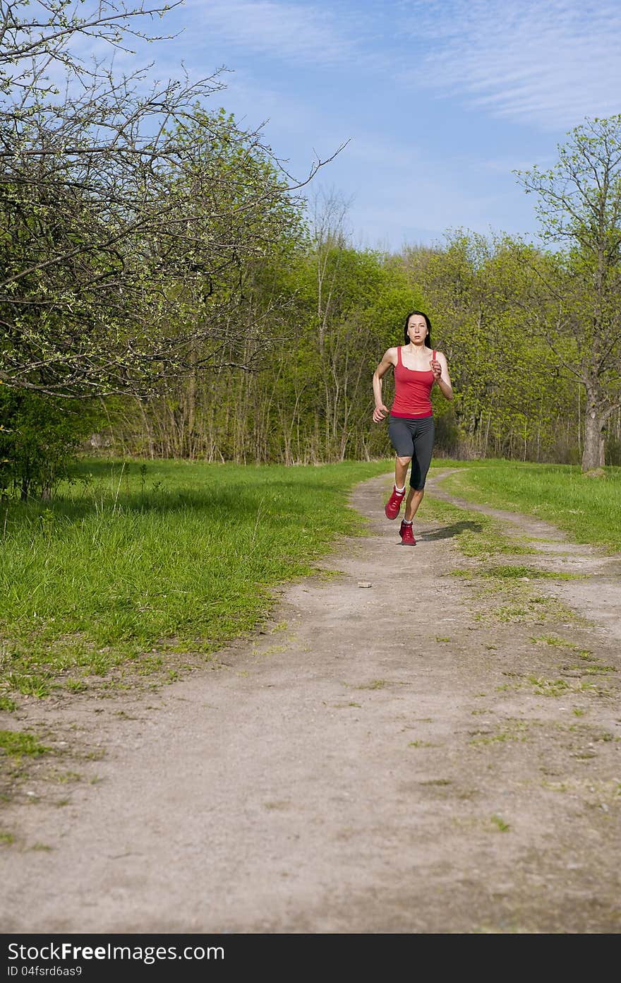 Jogging young athletic woman