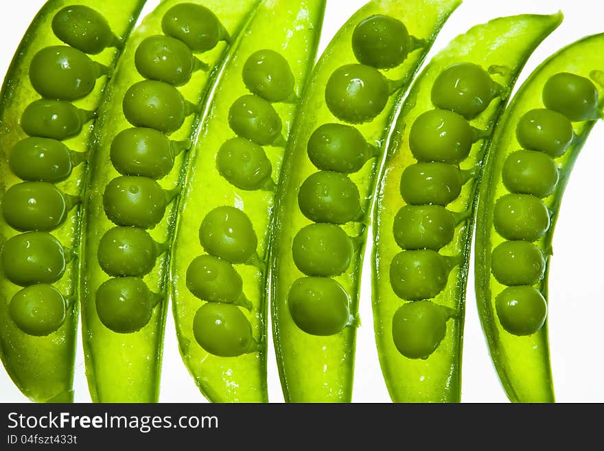 Transparent pea slices on white background