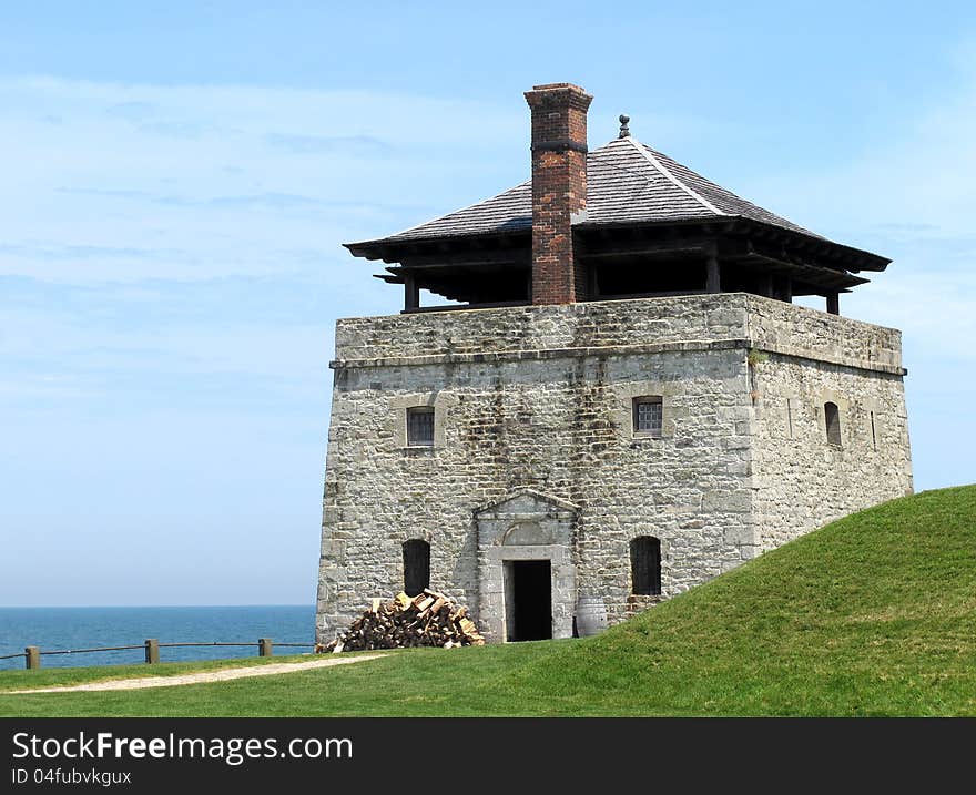 Large stone guard watch tower of an old fort, holding troops with cannons on the top. Large stone guard watch tower of an old fort, holding troops with cannons on the top.