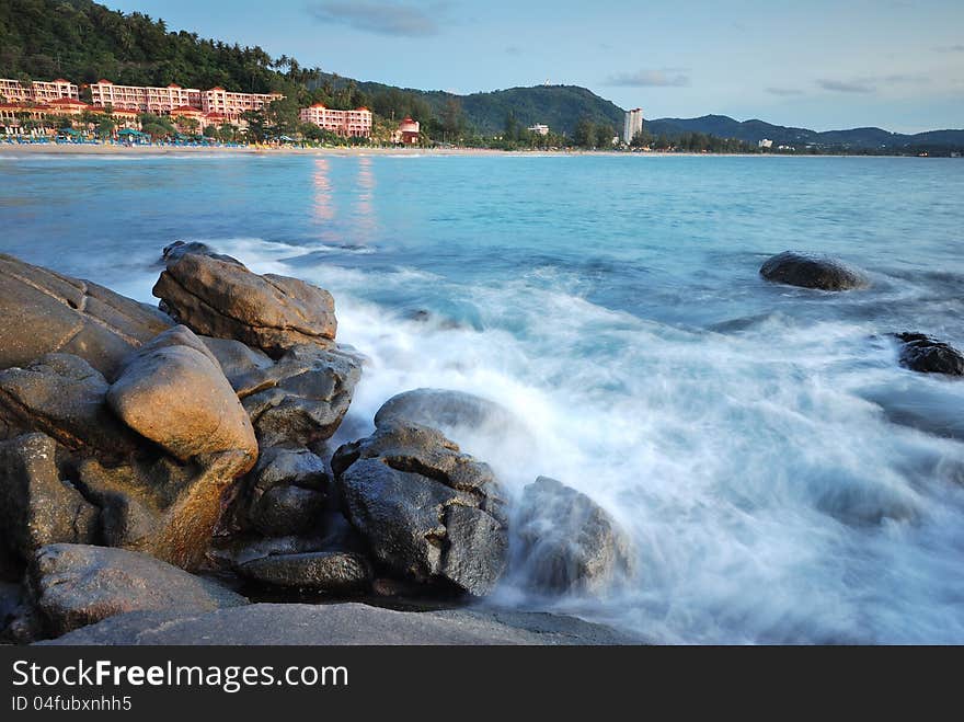 Stones In The Waves On Ocean Coast