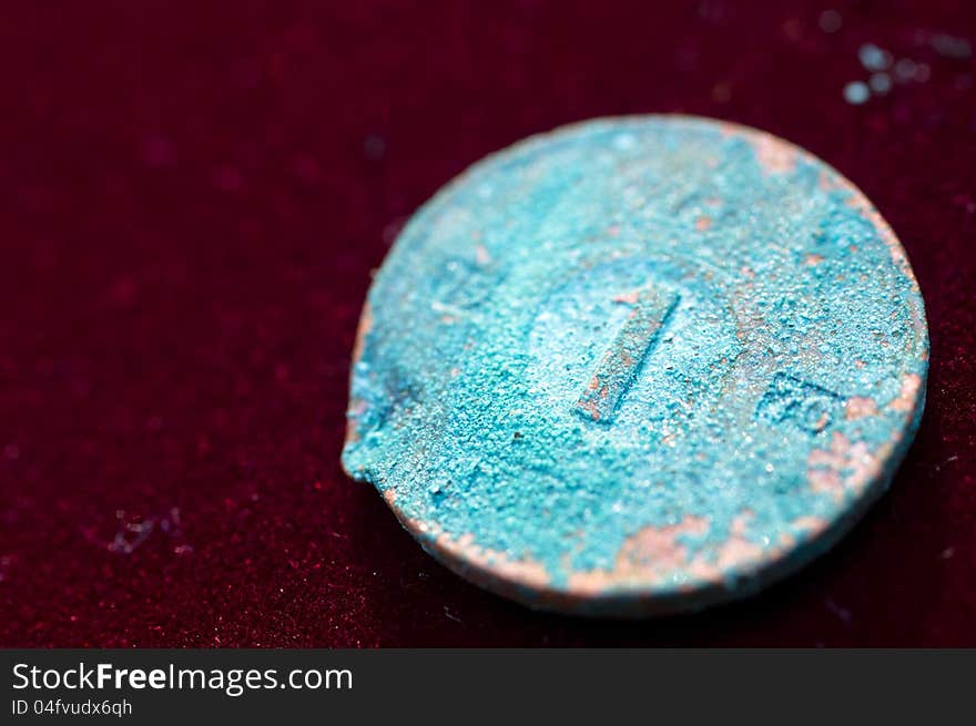 Corroded Blue Coin