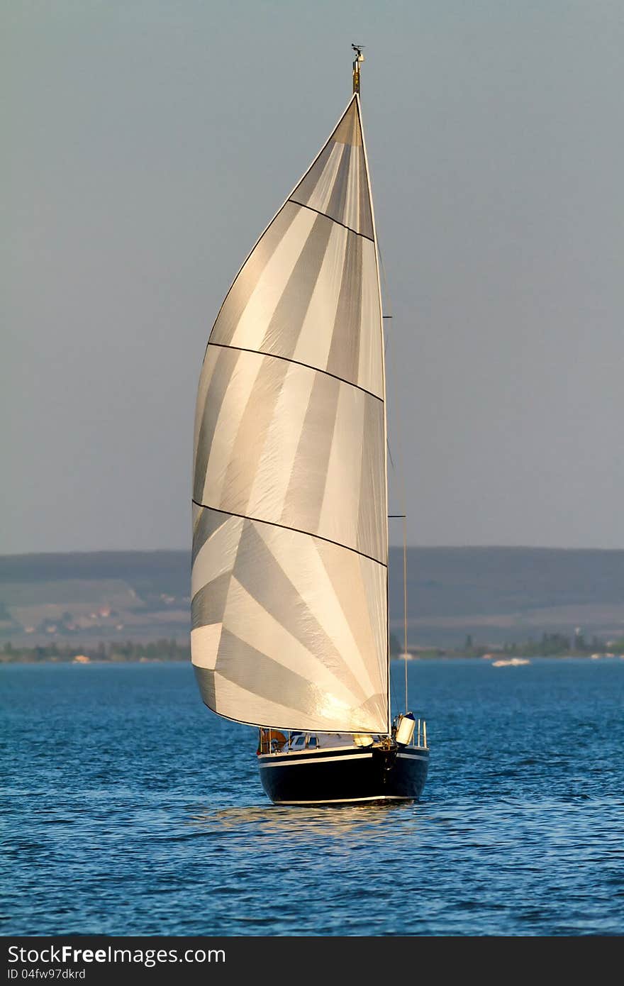 Beautiful sailing ship approaching in the lake