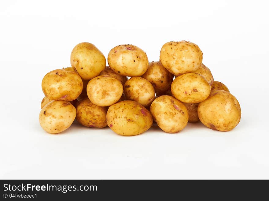 Bunch of potatoes on white background close up shoot