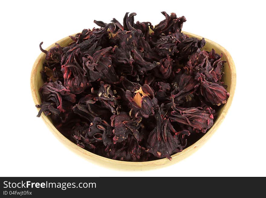 A bowl of dried Roselle Flowers (Hibiscus sabdarrifa) to make herbal tea, isolated on white. A bowl of dried Roselle Flowers (Hibiscus sabdarrifa) to make herbal tea, isolated on white