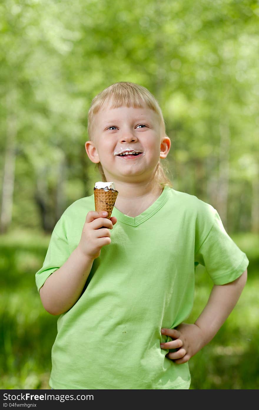 Young kid eating a tasty ice cream outdoor