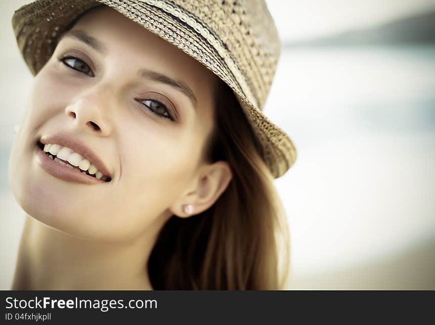 A woman smiling with brown eyes. A woman smiling with brown eyes