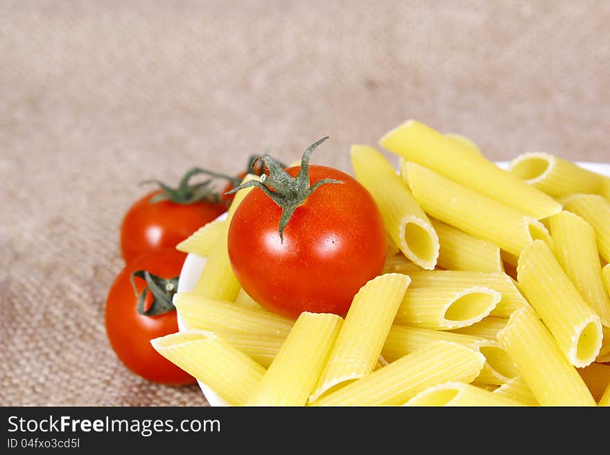 Italian pasta with tomato on a plate