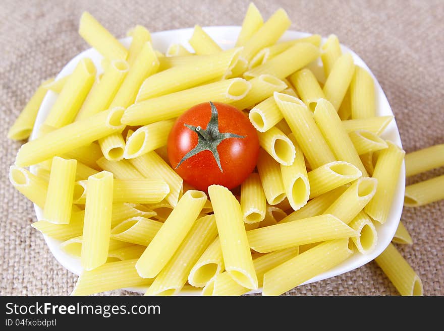 Italian pasta with tomato on a plate