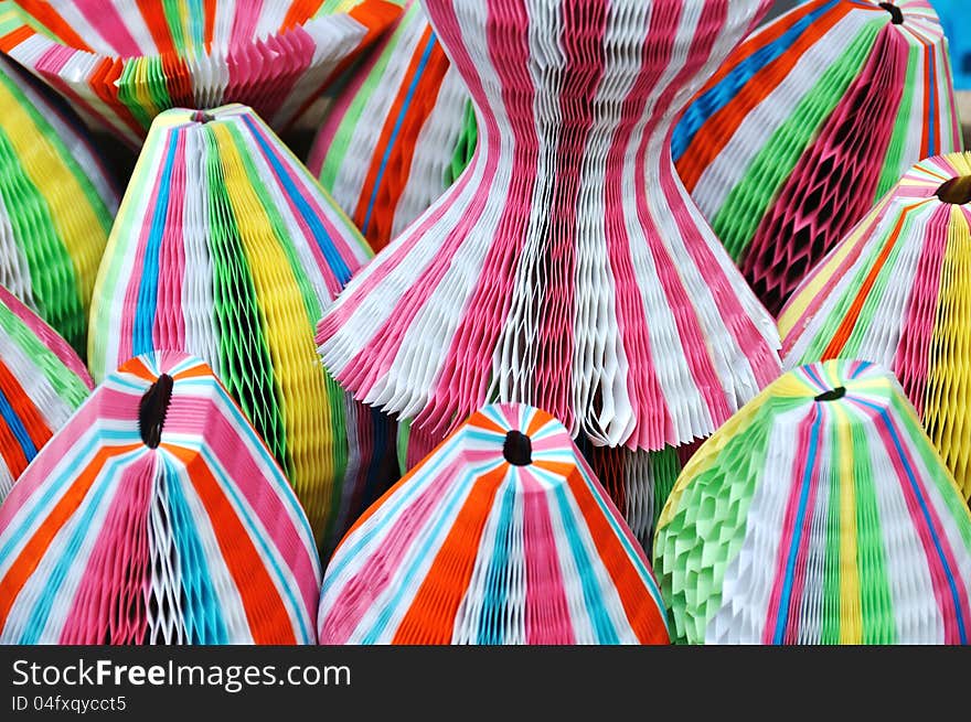 Colorful paper folding hats in a shop