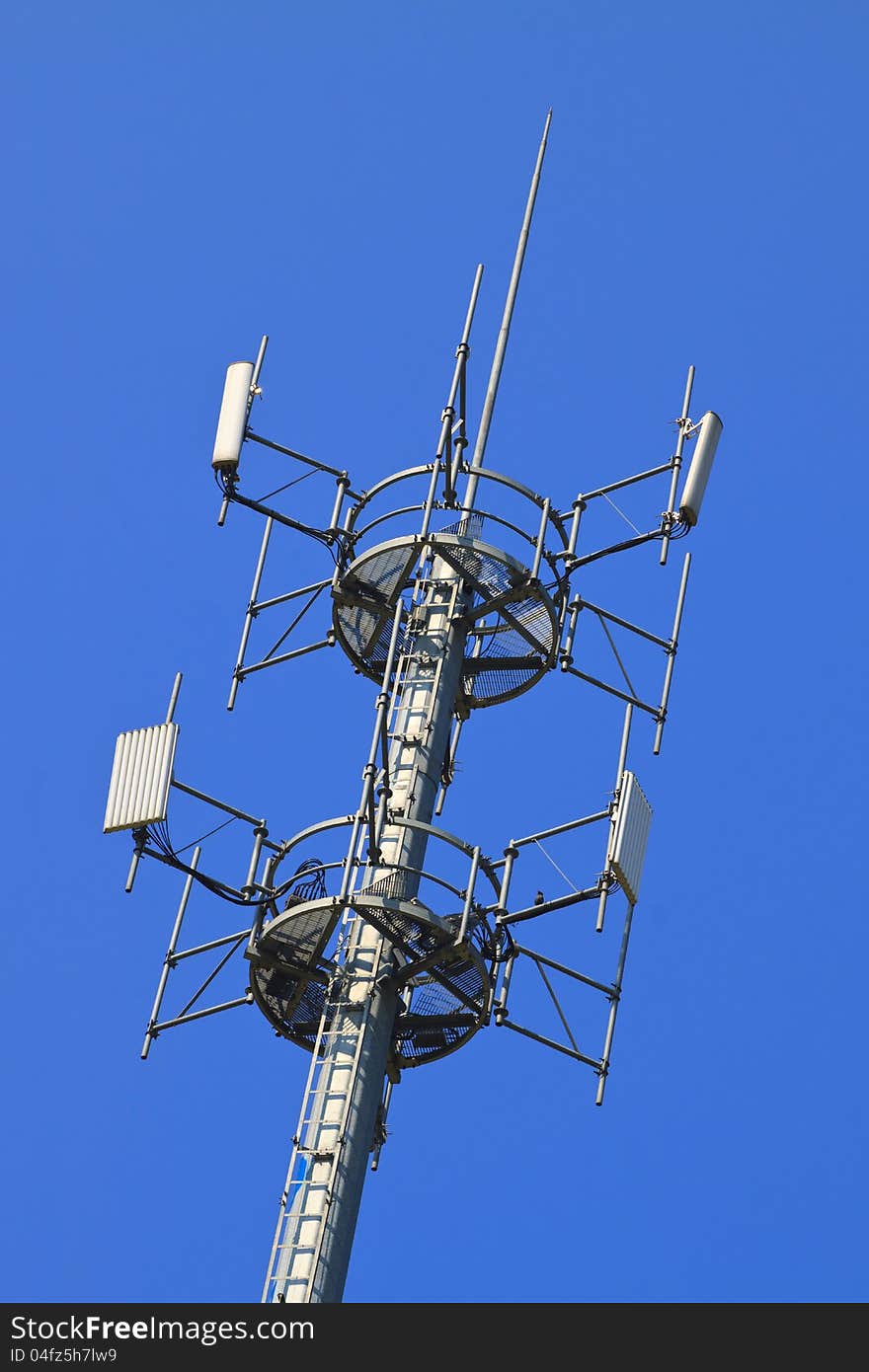 Telecommunications tower. Mobile phone base station in Blue Sky