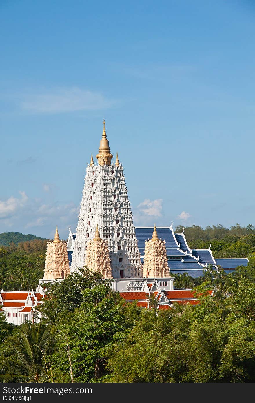 White Bodh Gaya style pagoda in blue sky