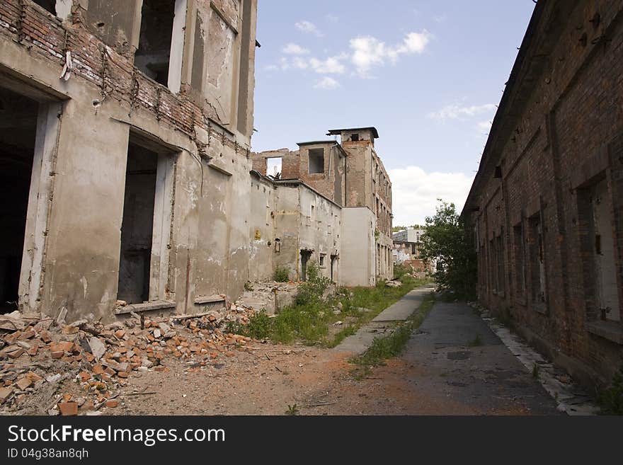 Street with ruins of buildings on both sides. Street with ruins of buildings on both sides