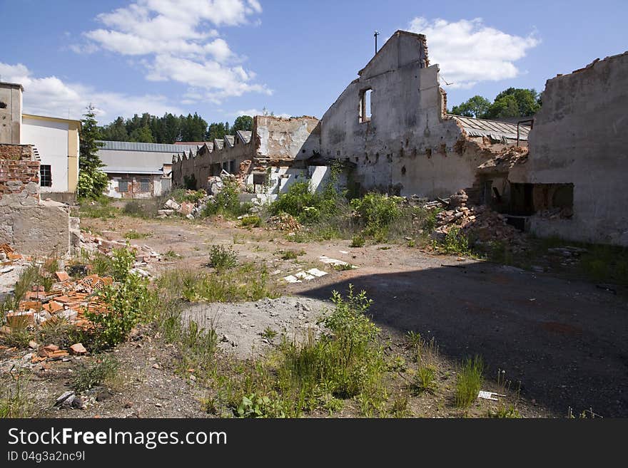 Complex of dilapidated buildings on a summer day. Complex of dilapidated buildings on a summer day