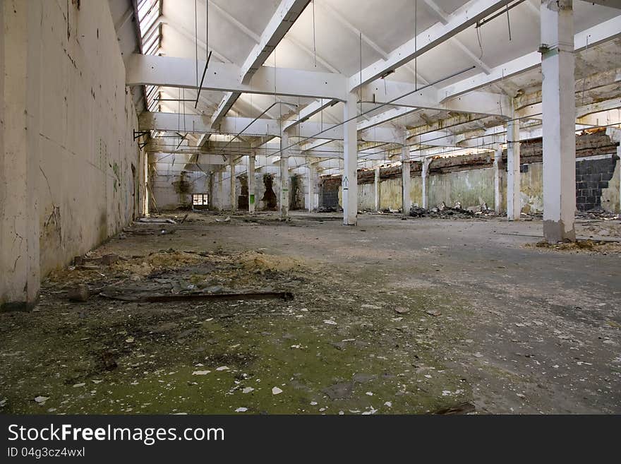 Devastated inside a former factory hall. Devastated inside a former factory hall