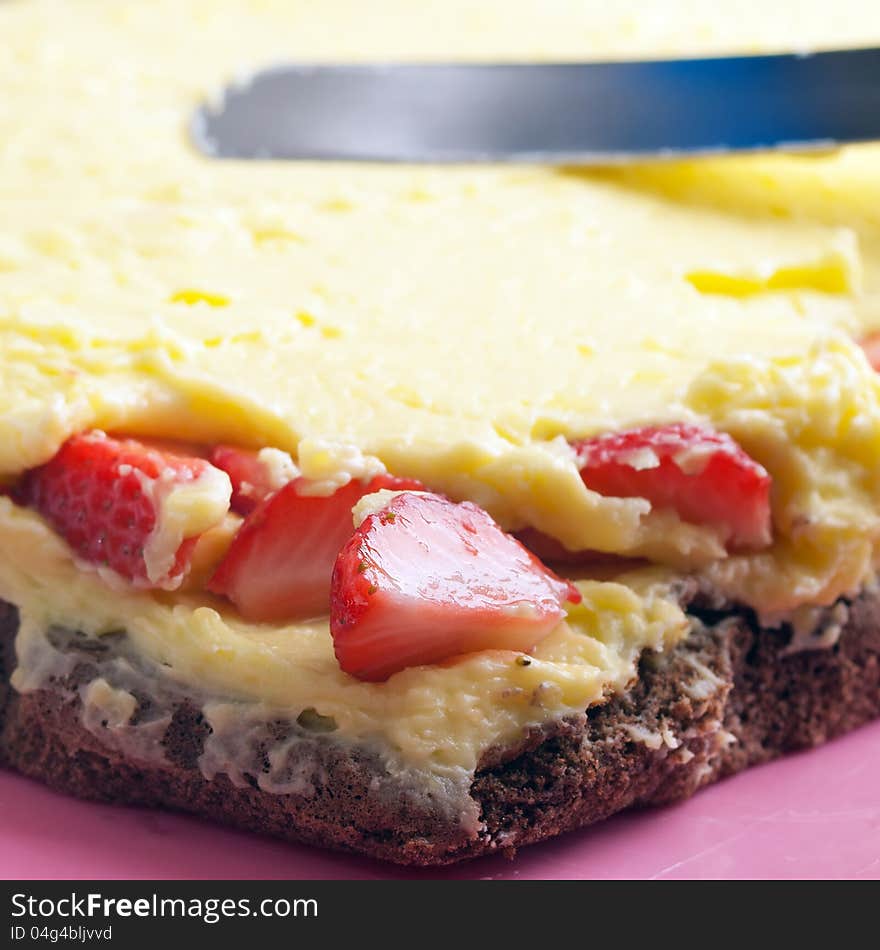 Cake production:yellow cream smearing on pie