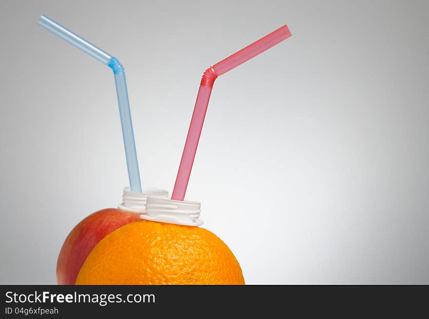 Orange And Apple With Straw