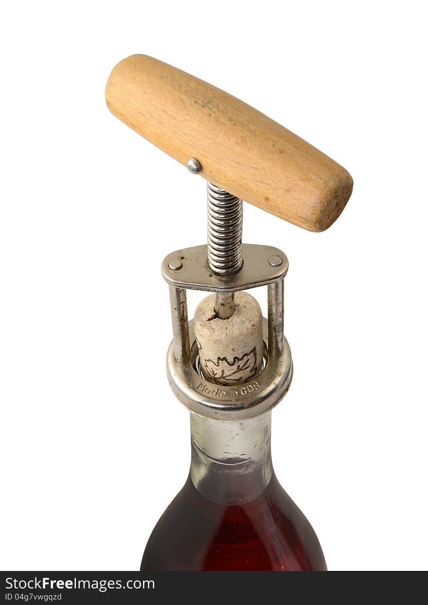 Closeup of bottle of vine with corkscrew on white background